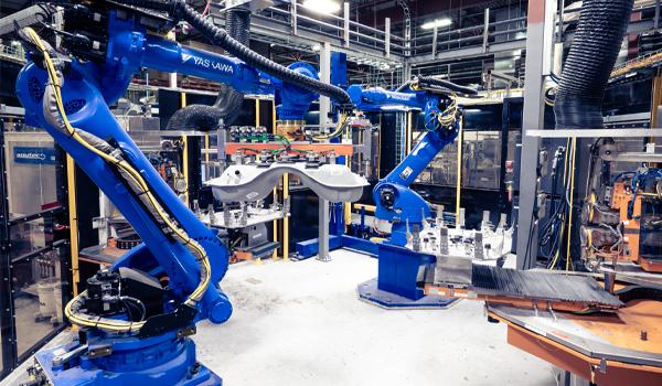 Robot arm assembling a fuel tank